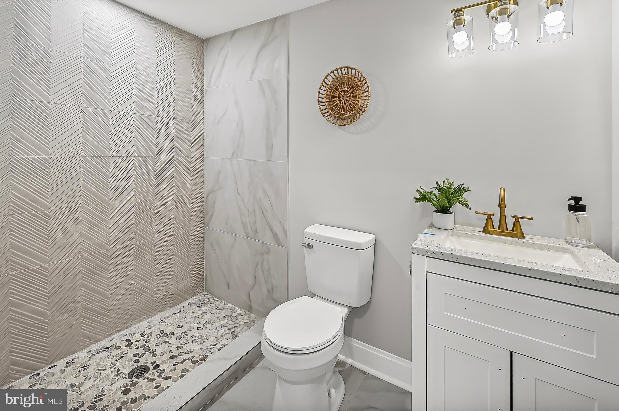 539 East 23rd Street Baltimore, MD 21218 - Photo 21 of 29 a bathroom with a toilet and a sink