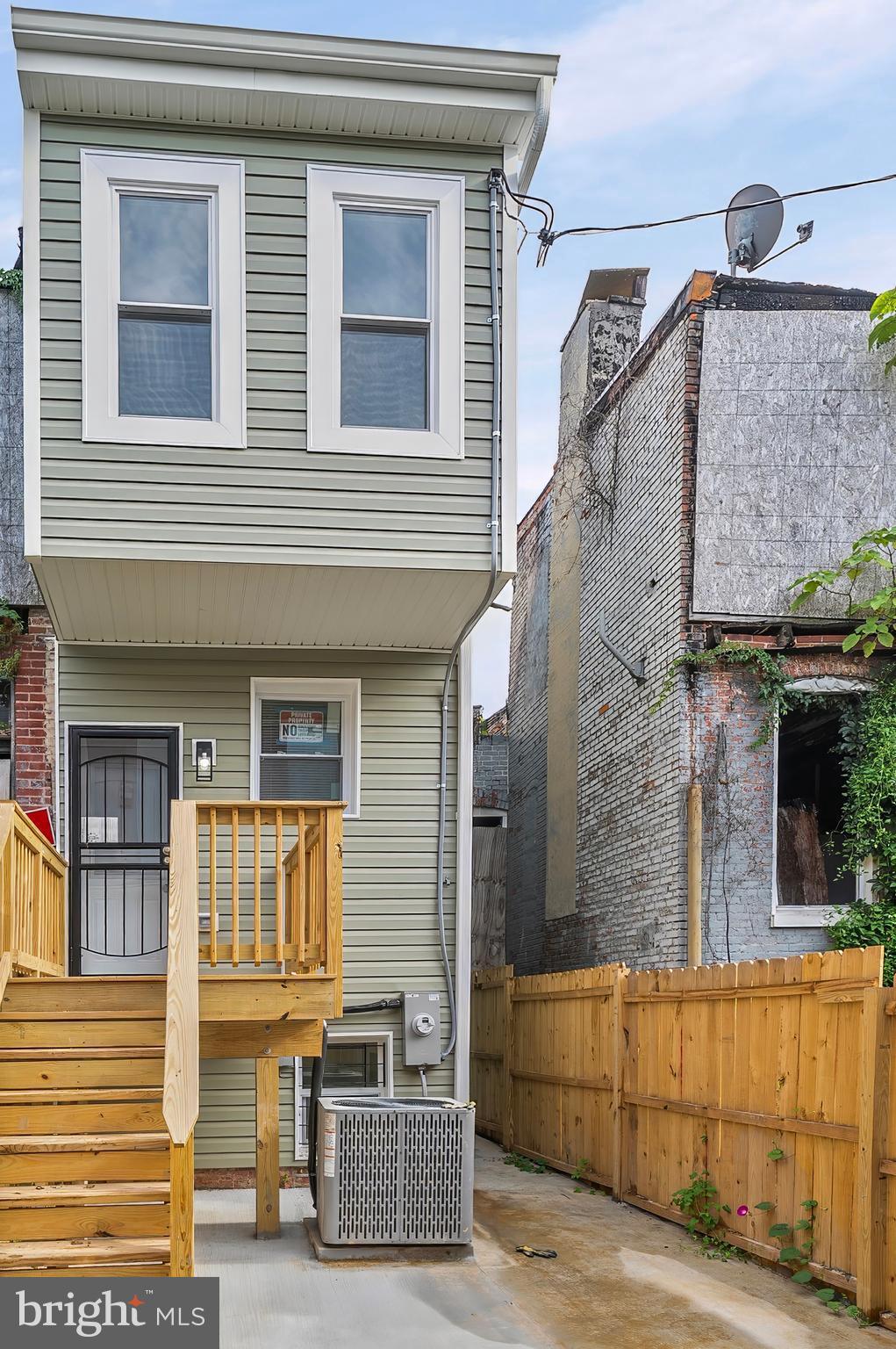 539 East 23rd Street Baltimore, MD 21218 - Photo 25 of 29 a front view of a house with glass windows