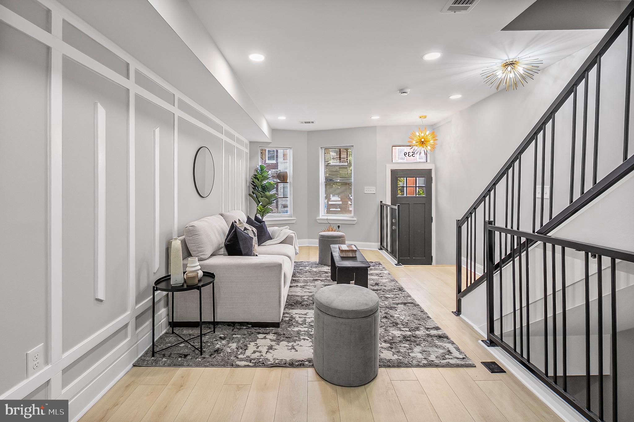 539 East 23rd Street Baltimore, MD 21218 - Photo 4 of 29 a living room with furniture and wooden floor
