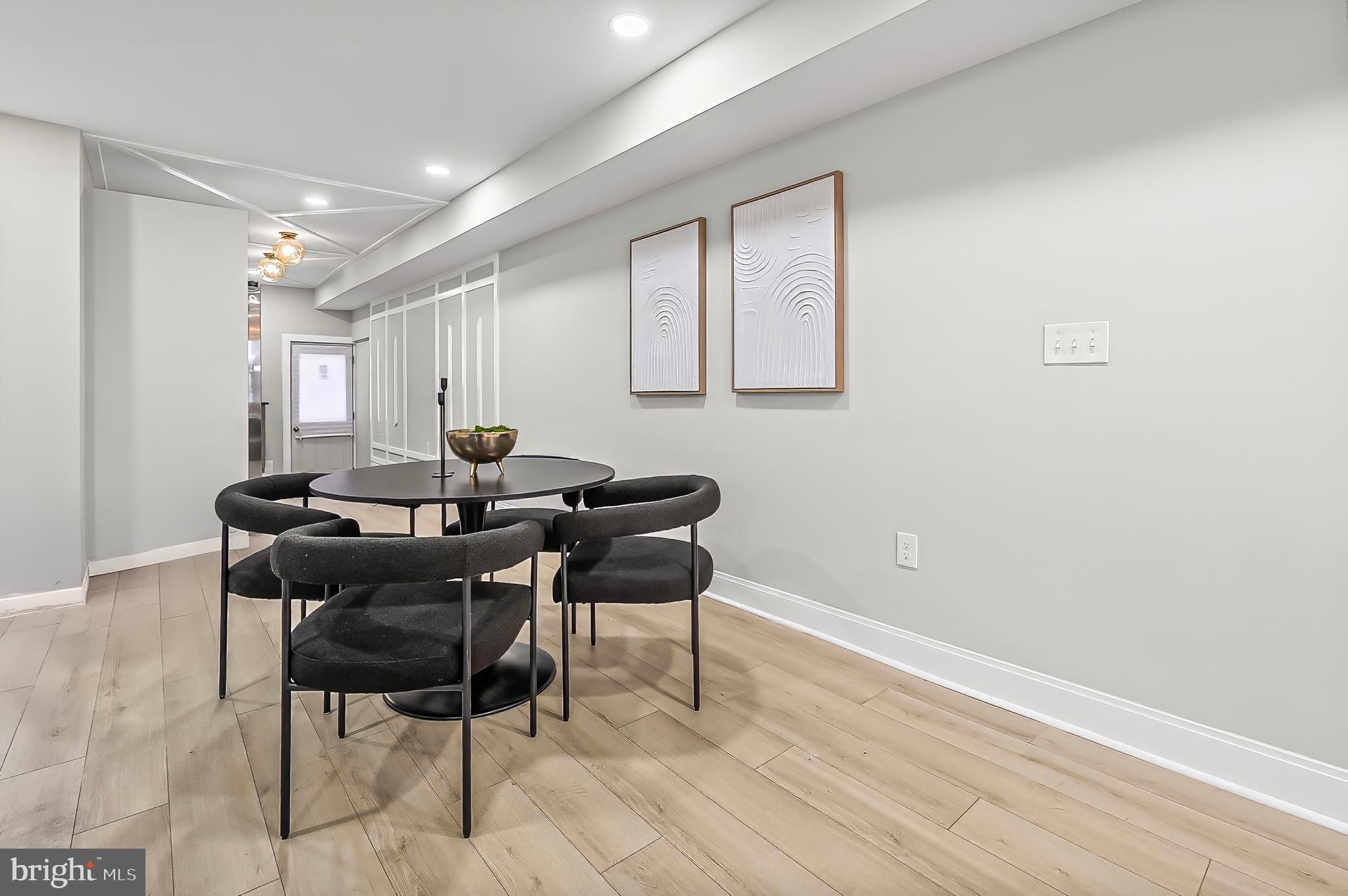 539 East 23rd Street Baltimore, MD 21218 - Photo 29 of 29 a work room with furniture and wooden floor