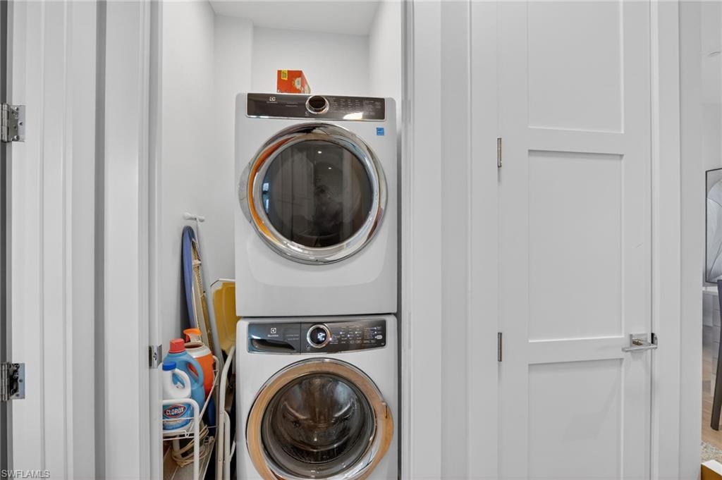 850 Central Avenue, Unit 208 Naples, FL 34102 - Photo 33 of 44 a utility room with dryer and washer