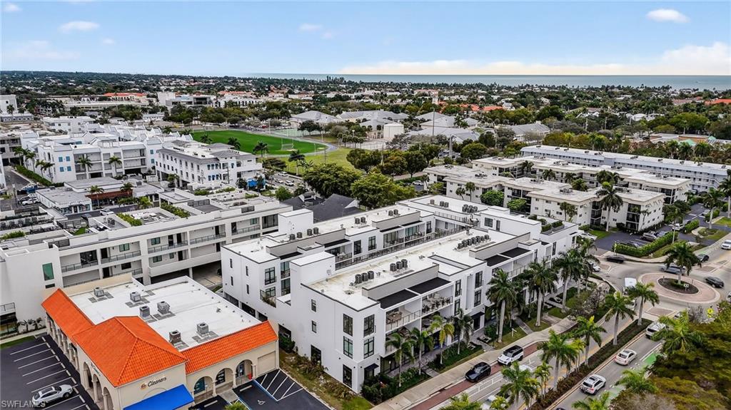 850 Central Avenue, Unit 208 Naples, FL 34102 - Photo 39 of 44 an aerial view of a building with parking space