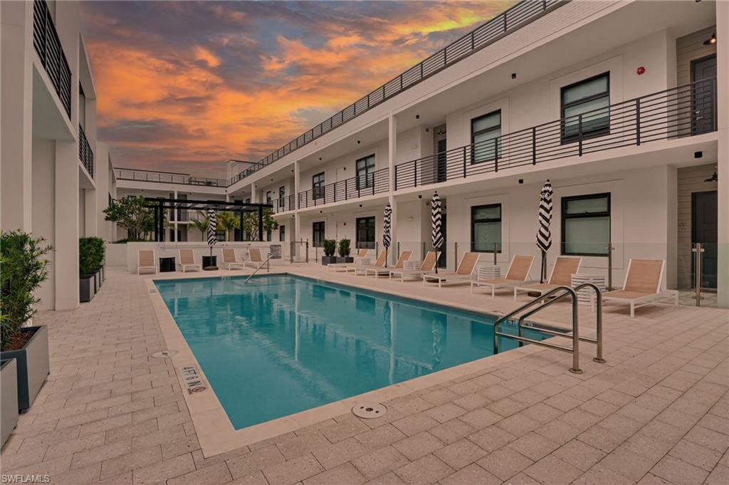 850 Central Avenue, Unit 208 Naples, FL 34102 - Photo 5 of 44 a view of a house with backyard porch and sitting area