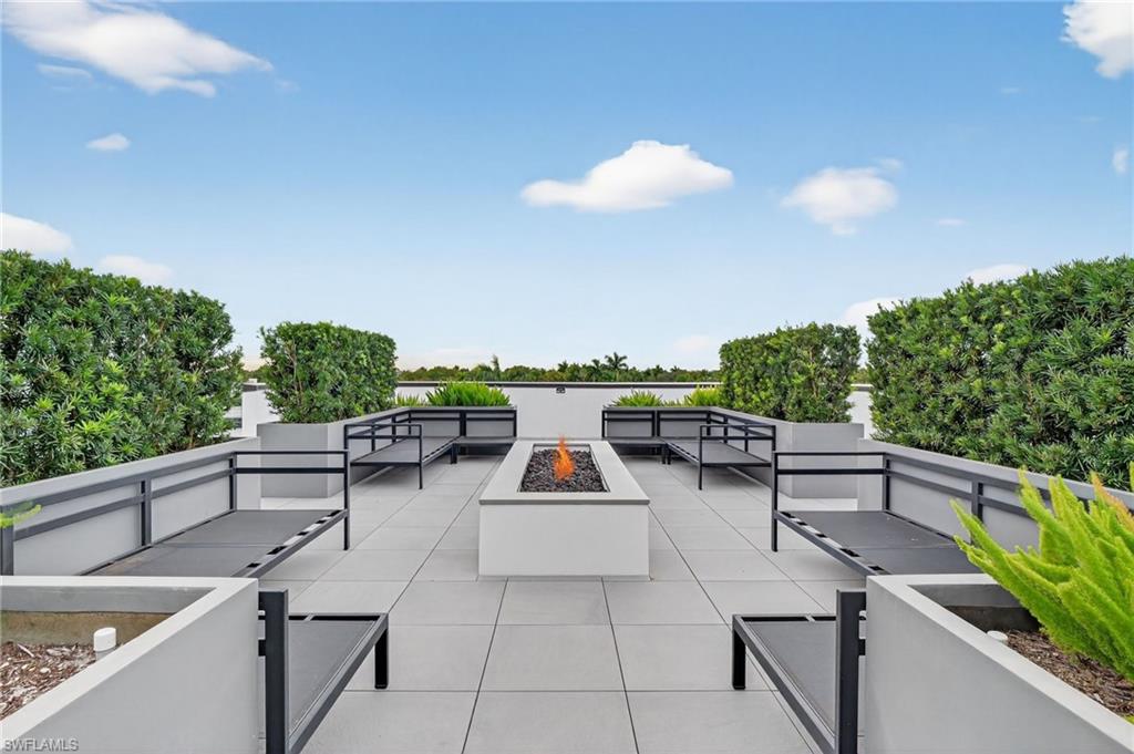 850 Central Avenue, Unit 208 Naples, FL 34102 - Photo 9 of 44 a view of a terrace with furniture and a potted plant