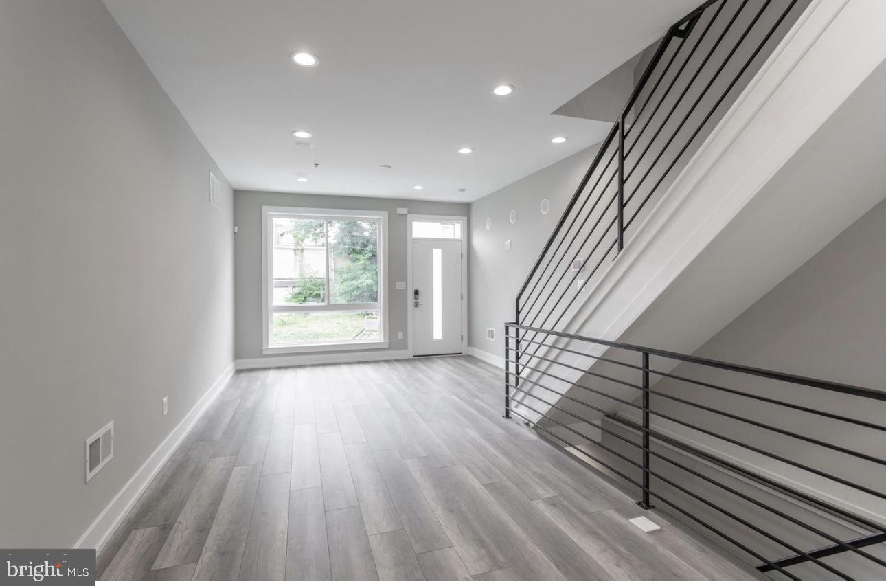 1425 Hanson Street Philadelphia, PA 19143 - Photo 3 of 25 wooden floor in an empty room with a window