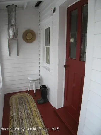 a view of a door and chair in a room