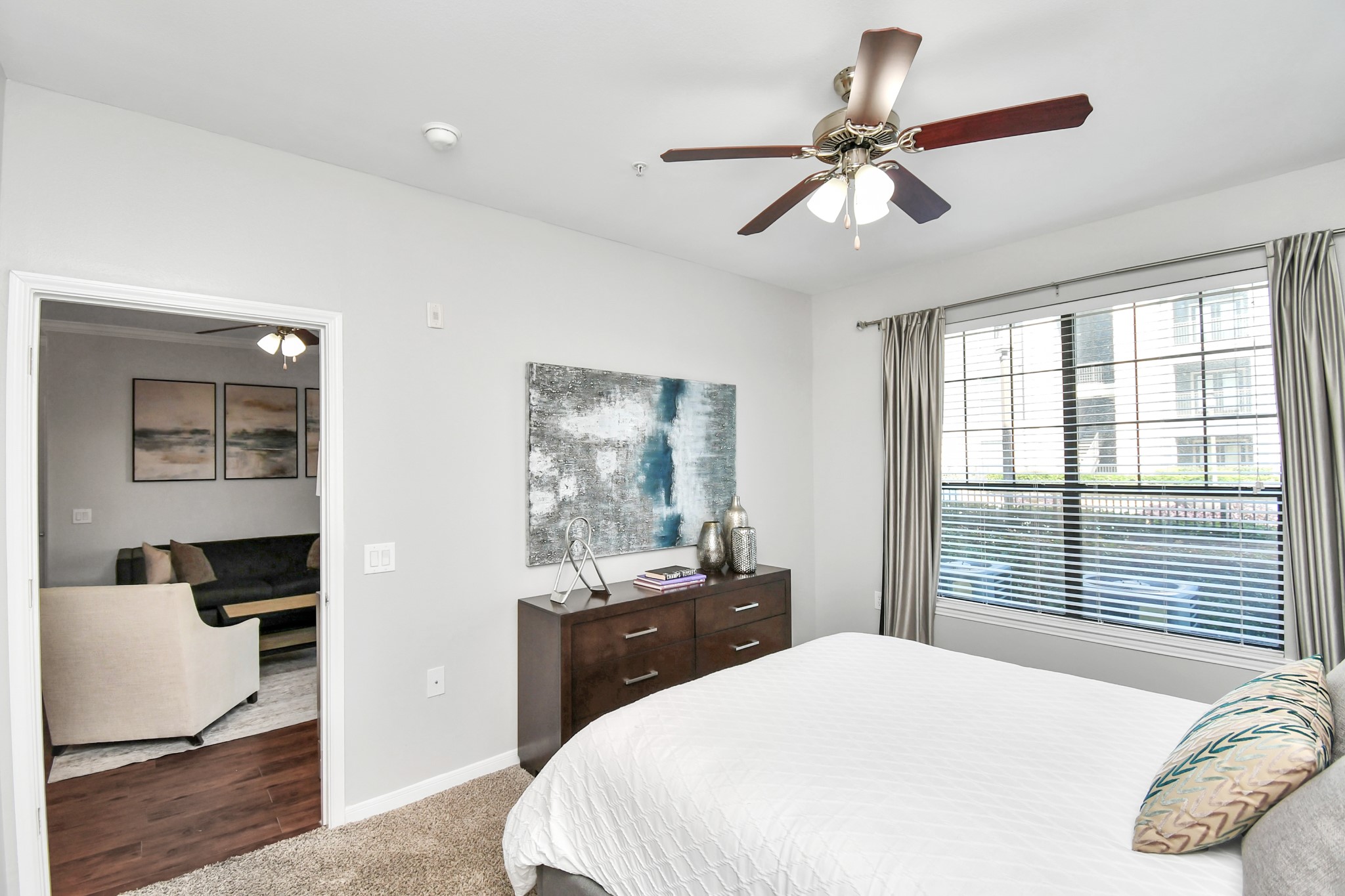 6777 Sommerall Drive, Unit 1636 Houston, TX 77084 - Photo 31 of 39 a bedroom with a bed and a chandelier