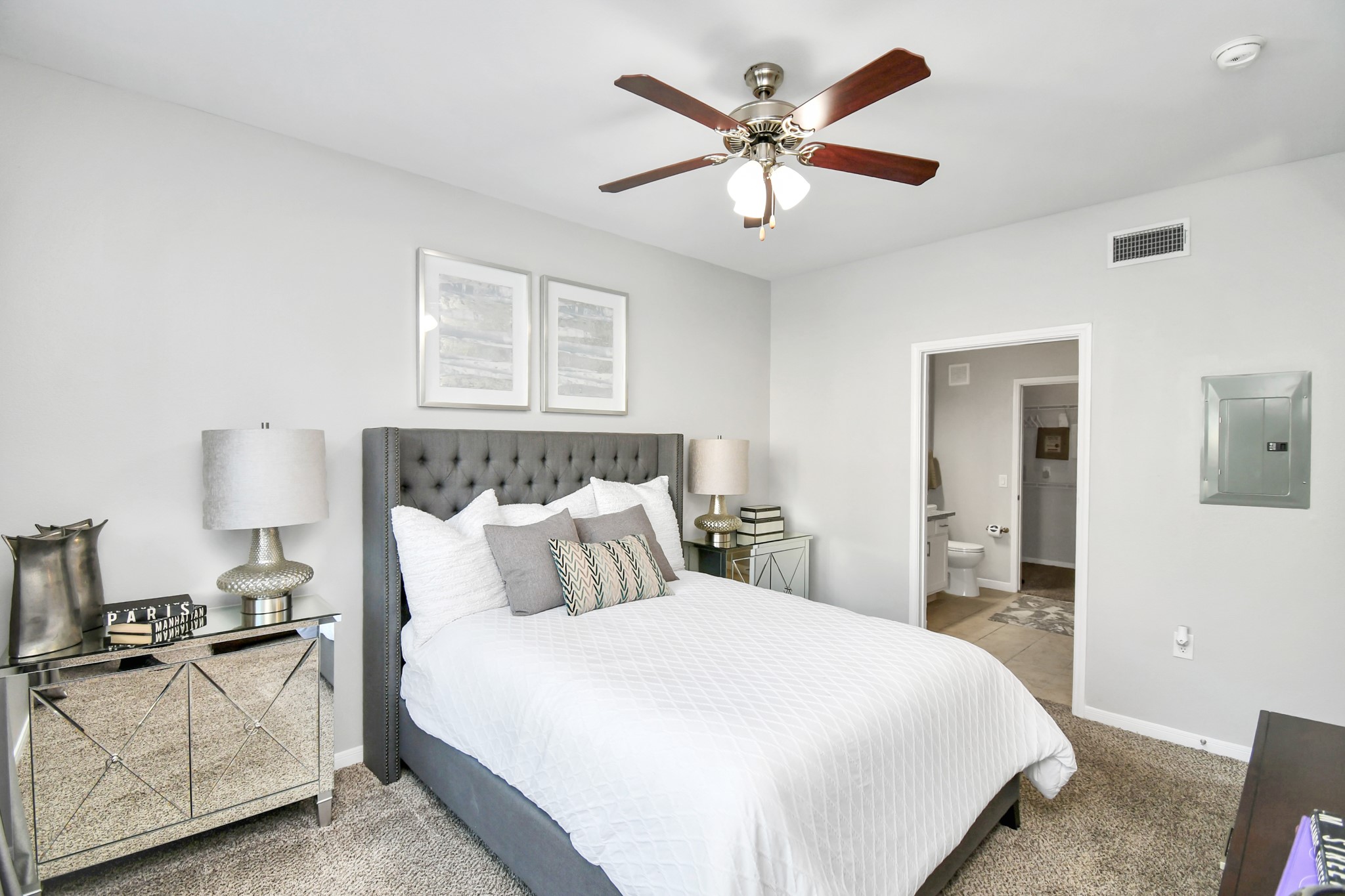 6777 Sommerall Drive, Unit 1636 Houston, TX 77084 - Photo 32 of 39 a bedroom with a large bed and a chandelier