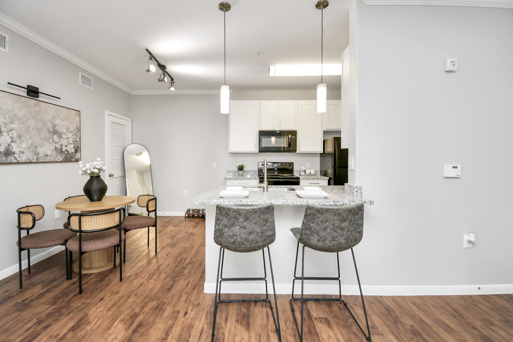 6777 Sommerall Drive, Unit 1636 Houston, TX 77084 - Photo 23 of 39 a dining room with furniture and wooden floor
