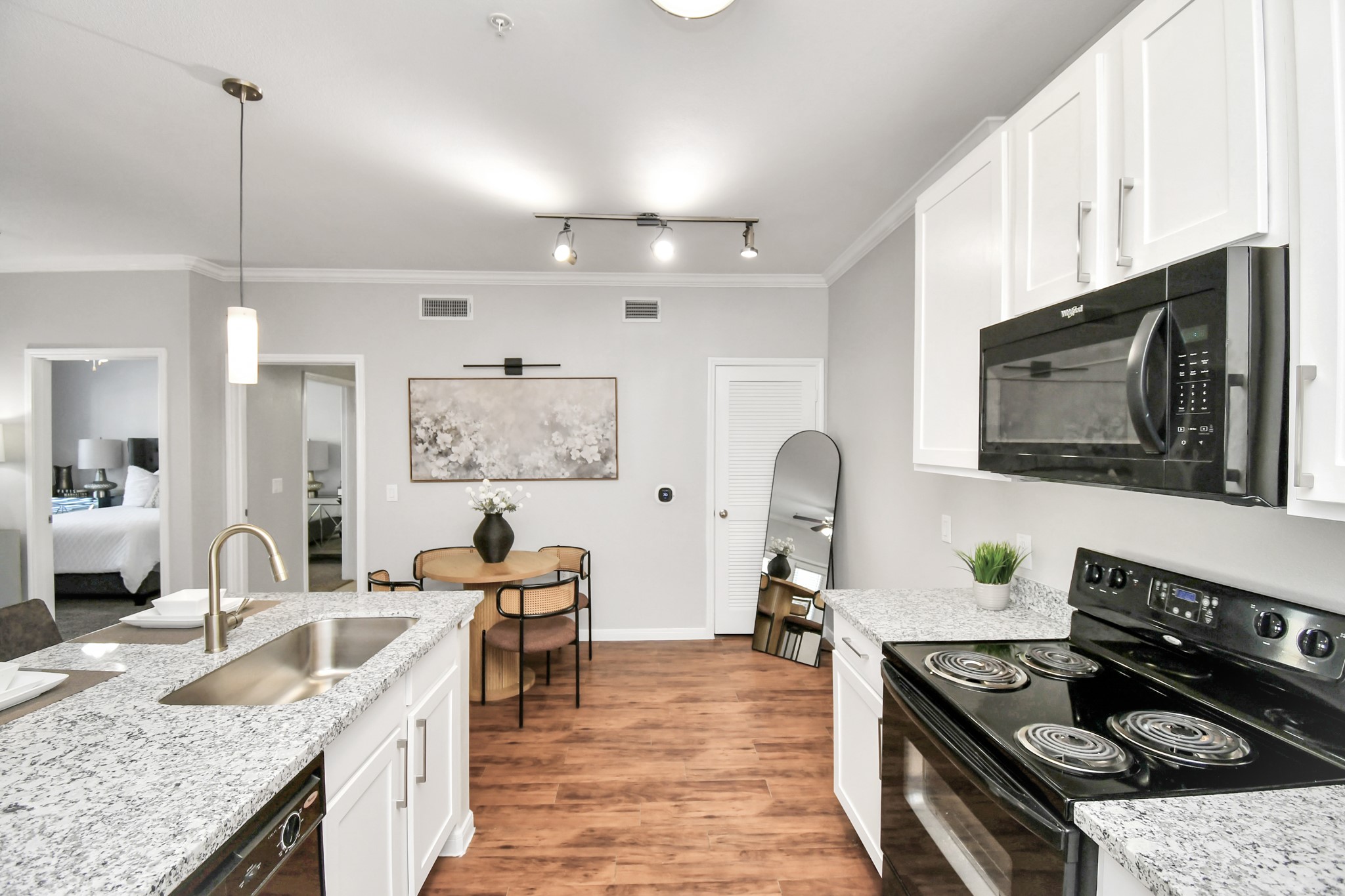 6777 Sommerall Drive, Unit 1636 Houston, TX 77084 - Photo 26 of 39 a kitchen with stainless steel appliances granite countertop a stove and a sink