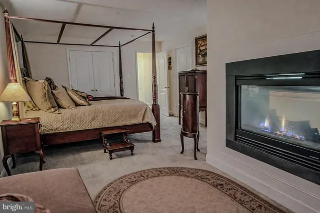 a bedroom with furniture and a window