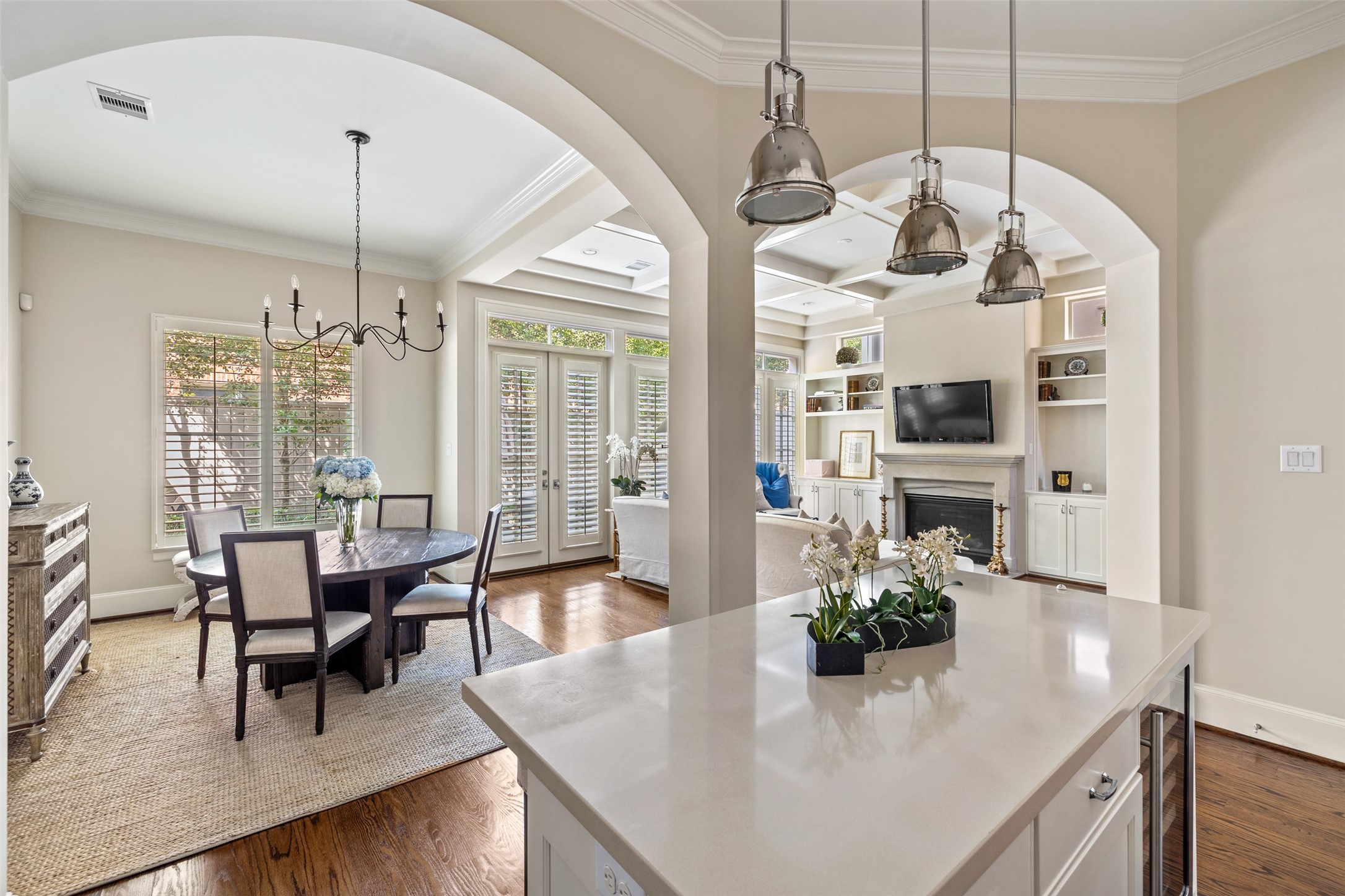 1202 Wynden Commons Lane Houston, TX 77056 - Photo 12 of 43 a dining room with furniture a chandelier and wooden floor