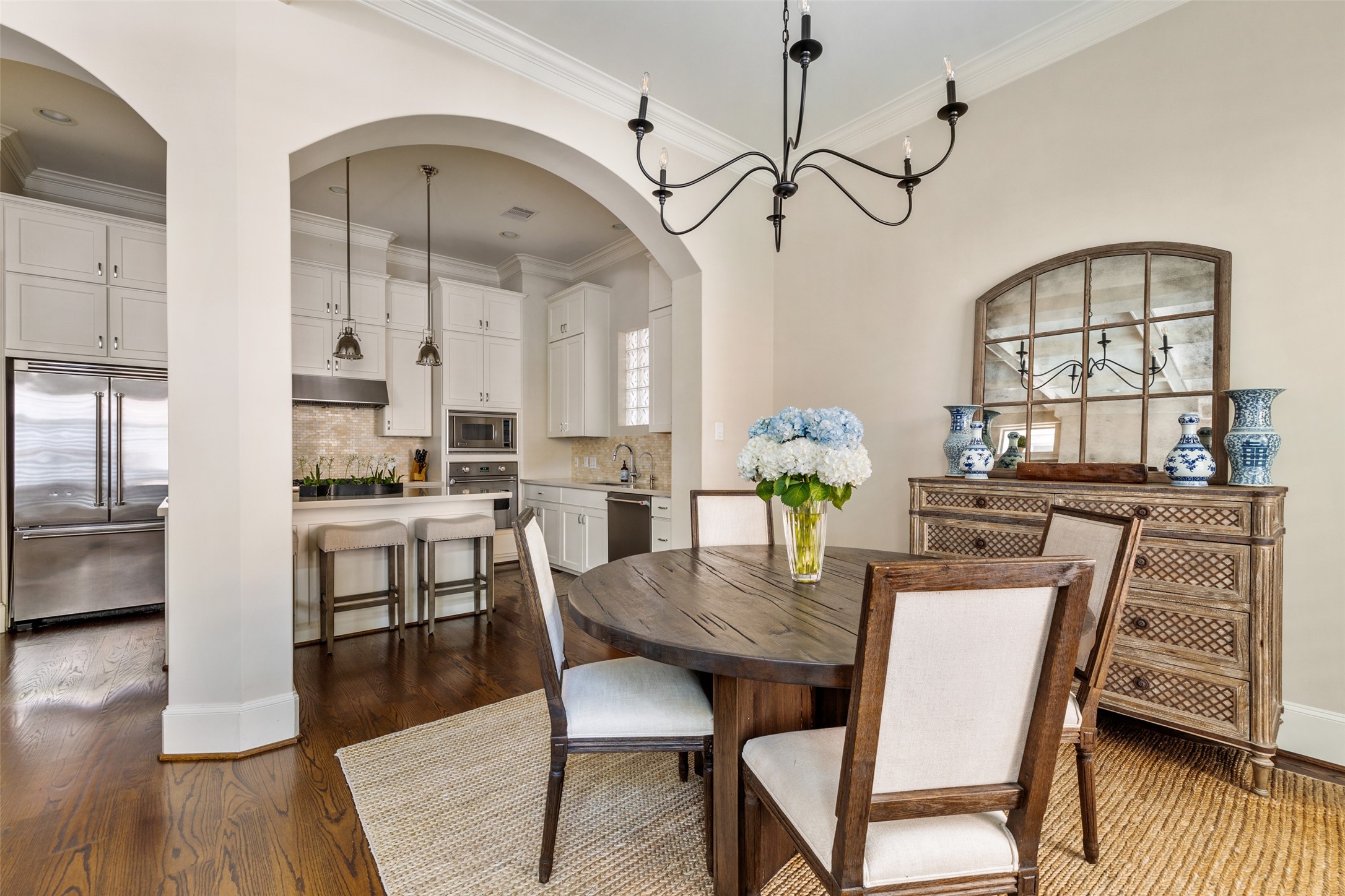 1202 Wynden Commons Lane Houston, TX 77056 - Photo 13 of 43 a view of a dining room with furniture window and wooden floor