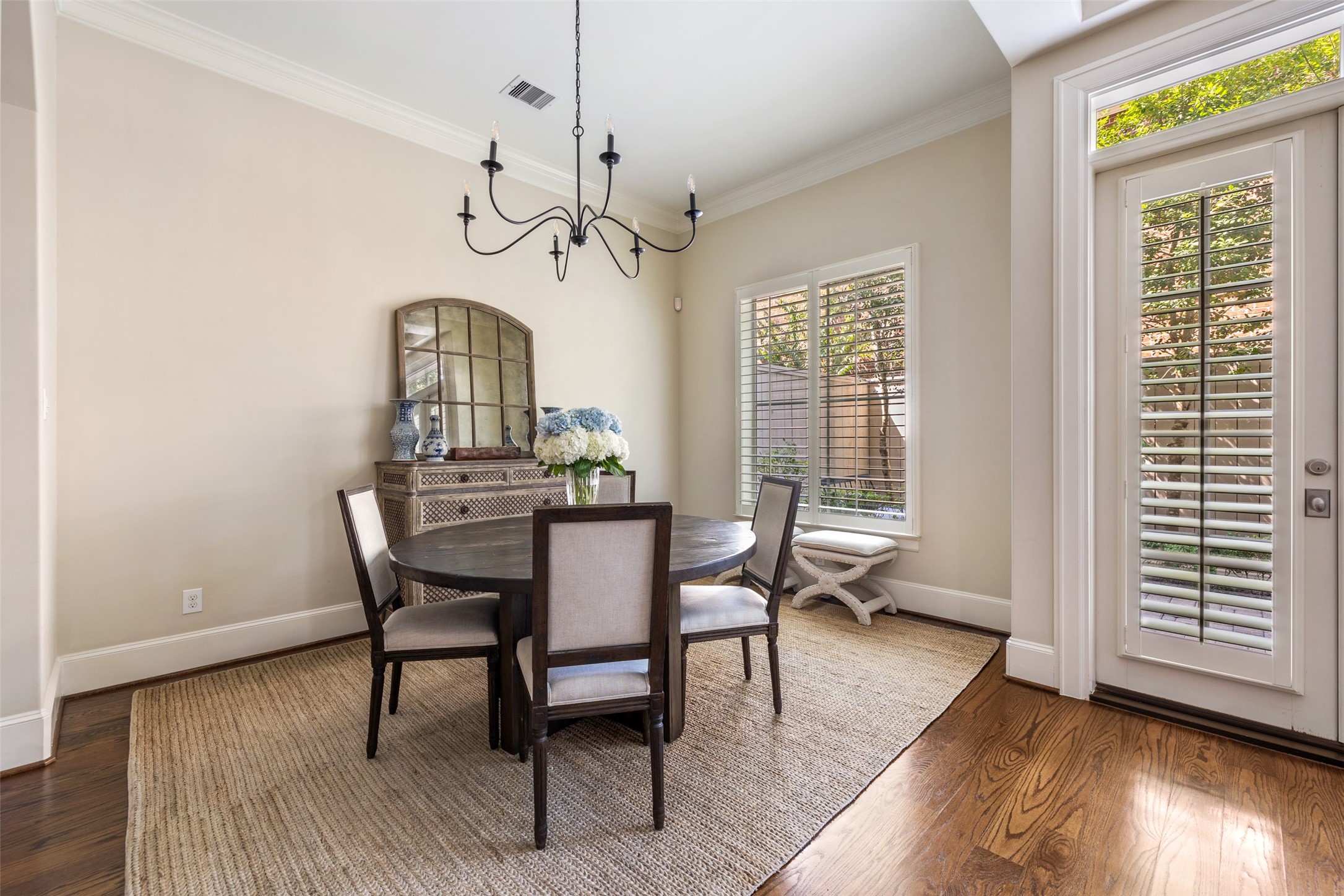 1202 Wynden Commons Lane Houston, TX 77056 - Photo 14 of 43 a view of a dining room with furniture window and wooden floor