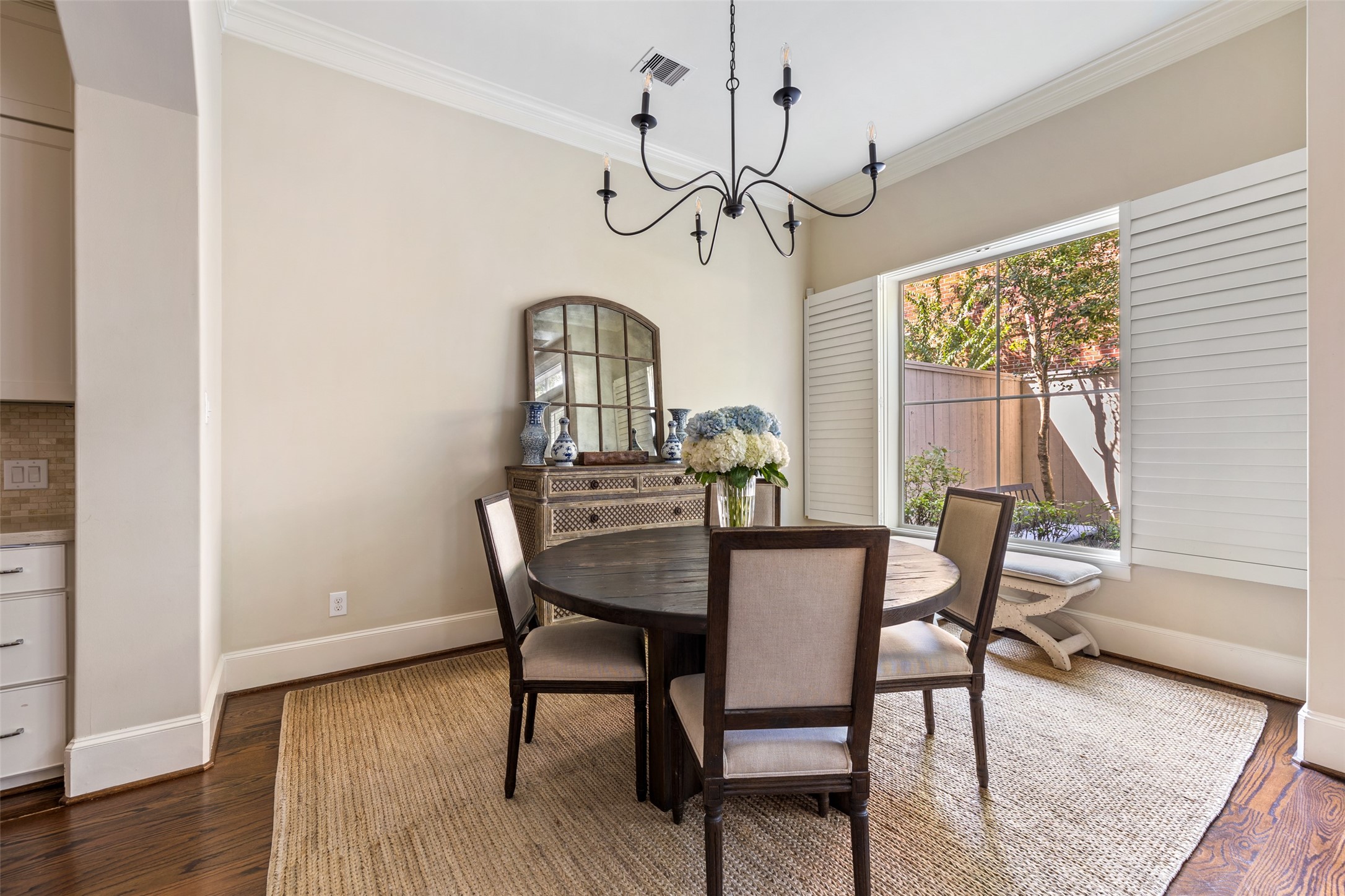 1202 Wynden Commons Lane Houston, TX 77056 - Photo 15 of 43 a view of a dining room with furniture window and wooden floor