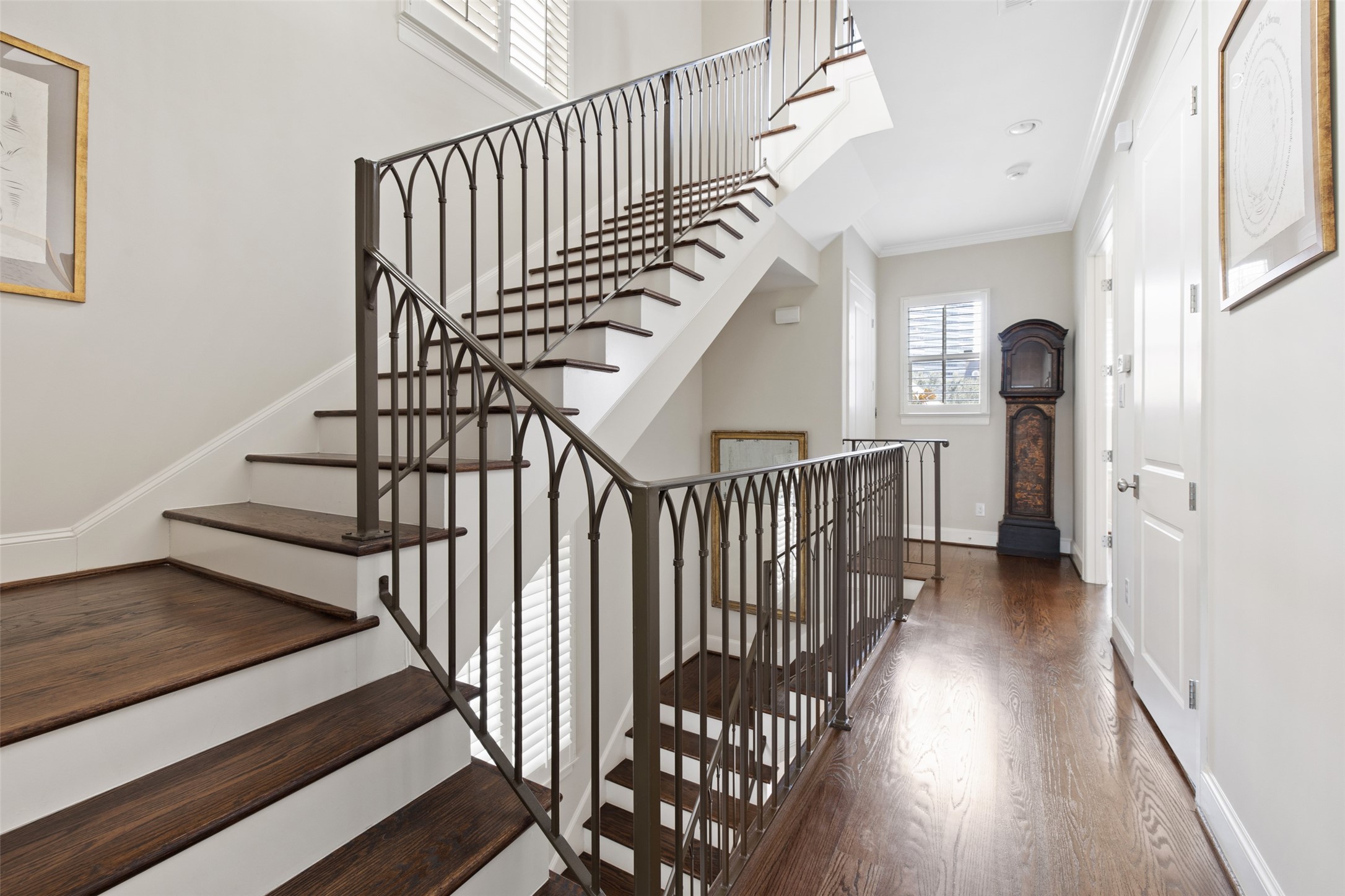 1202 Wynden Commons Lane Houston, TX 77056 - Photo 17 of 43 a view of staircase with railing and white walls
