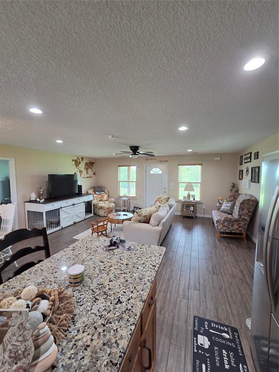 511 Erwin Road Poolville, TX 76487 - Photo 13 of 40 Looking into Living room