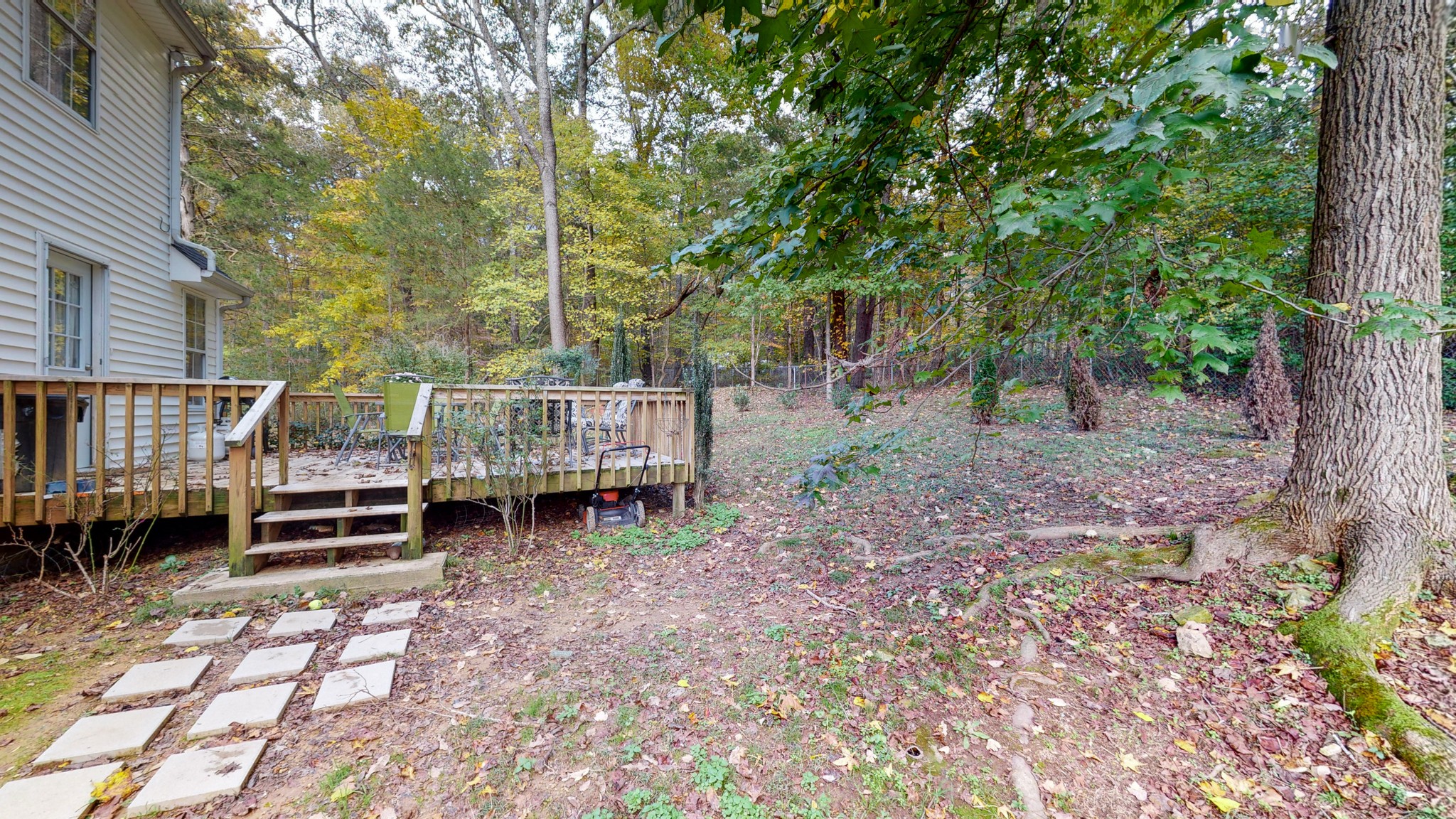 1081 Meeks Cemetery Road Burns, TN 37029 - Photo 11 of 45 a backyard of a house with barbeque oven and outdoor seating