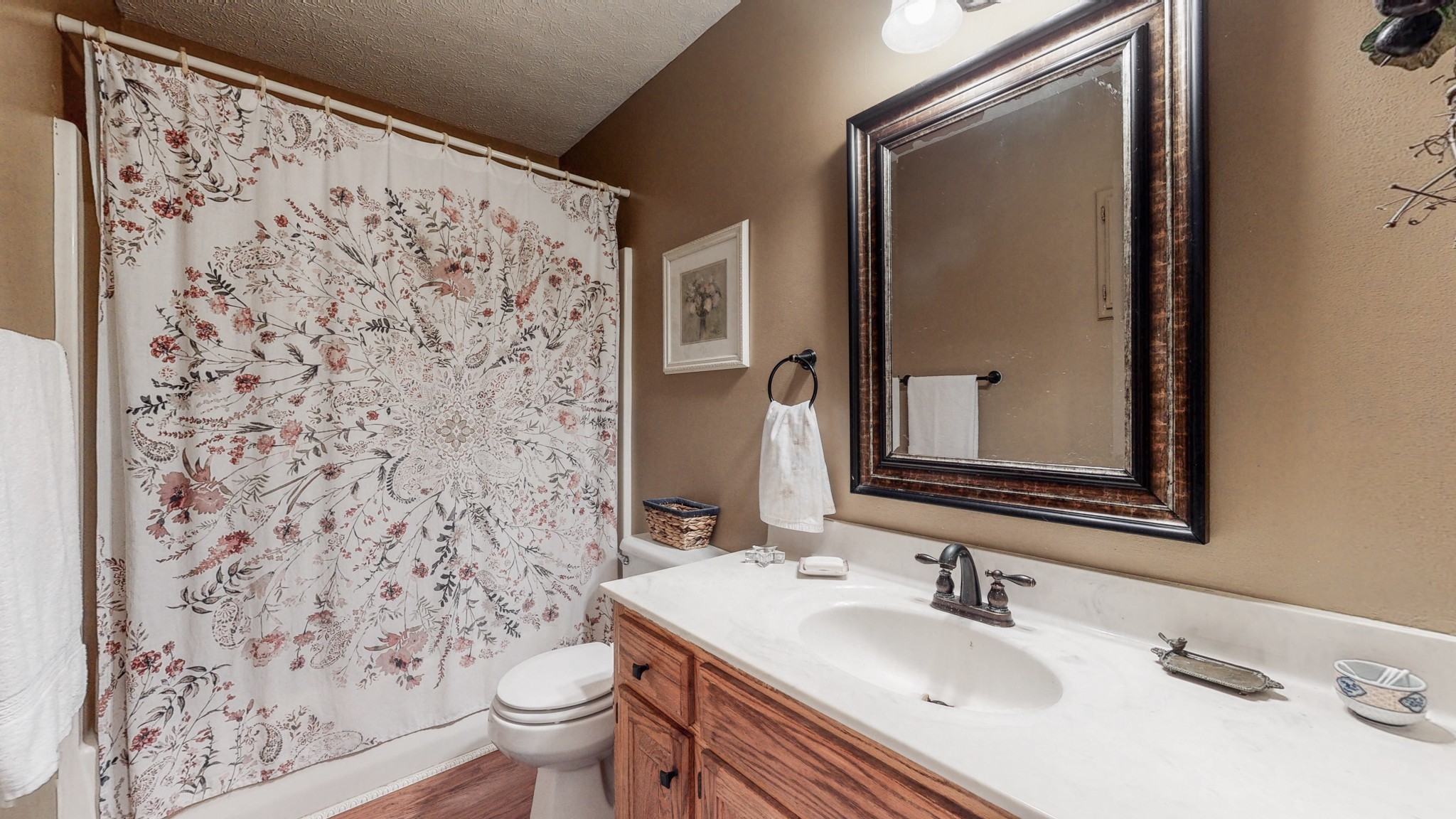 1081 Meeks Cemetery Road Burns, TN 37029 - Photo 22 of 45 a bathroom with a sink toilet and mirror