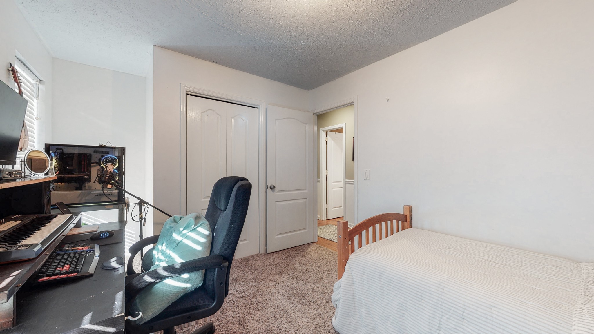 1081 Meeks Cemetery Road Burns, TN 37029 - Photo 27 of 45 a bedroom with a bed a desk and chair