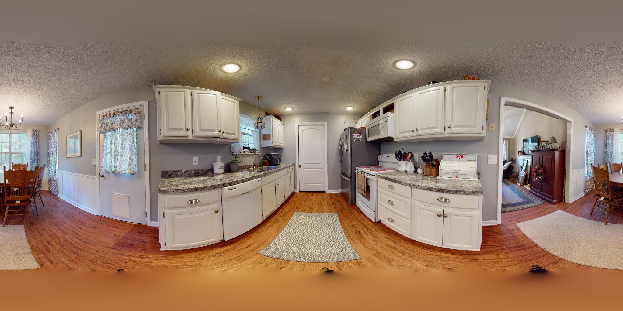 1081 Meeks Cemetery Road Burns, TN 37029 - Photo 40 of 45 a kitchen with white cabinets and stainless steel appliances