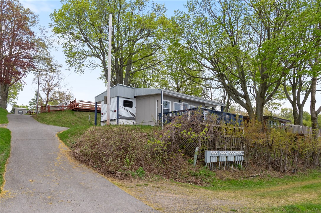 7945 Lake Road, Unit 86 Sodus, NY 14555 - Photo 19 of 22 The blacktop road makes it simple to navigate the