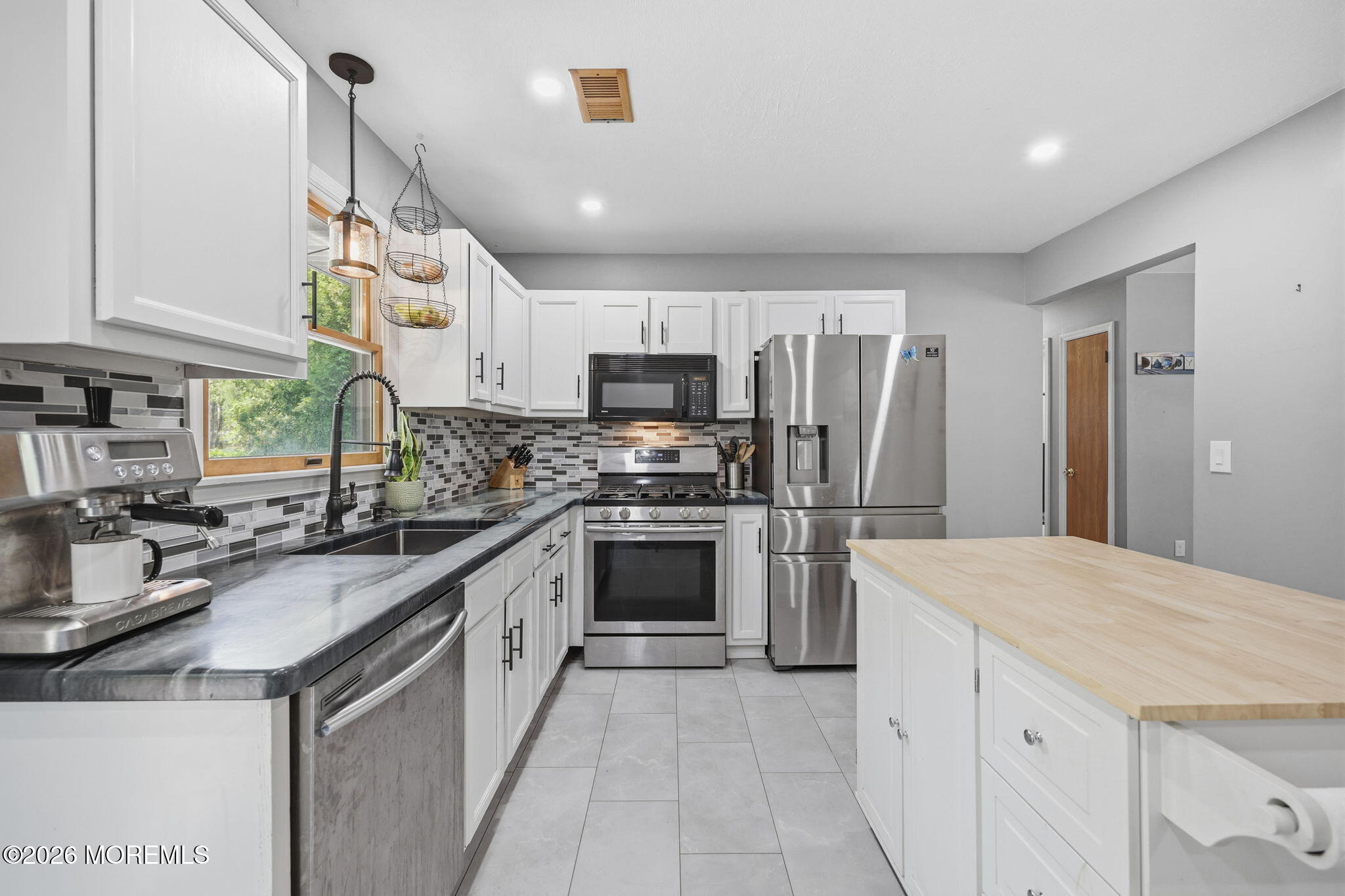 356 Leesville Road Jackson, NJ 08527 - Photo 17 of 46 a kitchen with kitchen island granite countertop appliances cabinets and a sink