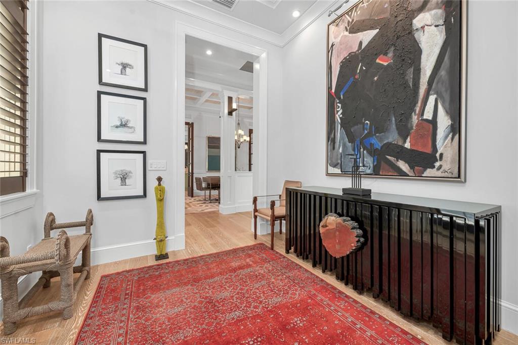 2284 Crayton Road Naples, FL 34103 - Photo 3 of 34 a bedroom with a bed and a dresser