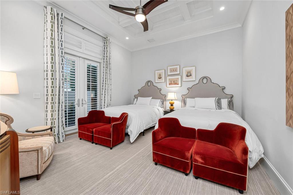 2284 Crayton Road Naples, FL 34103 - Photo 32 of 34 a bedroom with furniture and wooden floor