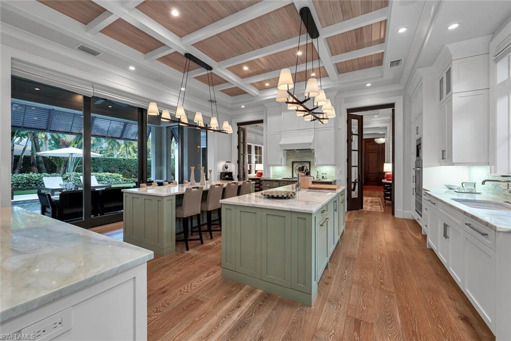 2284 Crayton Road Naples, FL 34103 - Photo 8 of 34 a kitchen with lots of counter top space