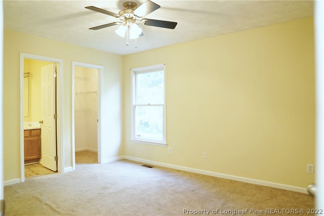 2029 Ashton Road Fayetteville, NC 28304 - Photo 17 of 37 an empty room with windows and fan