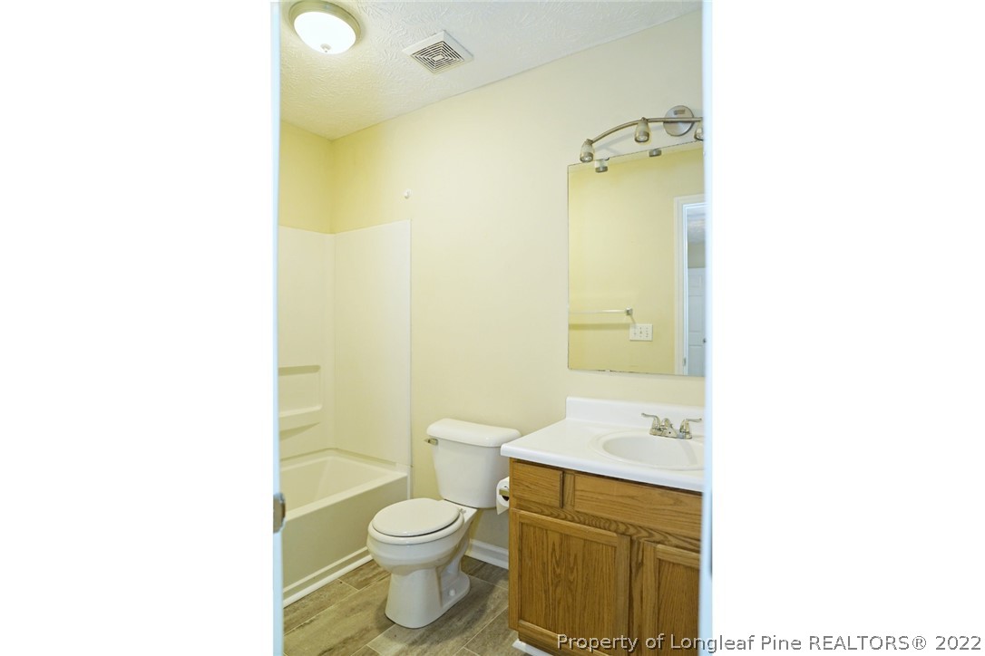 2029 Ashton Road Fayetteville, NC 28304 - Photo 20 of 37 a bathroom with a sink a toilet and shower