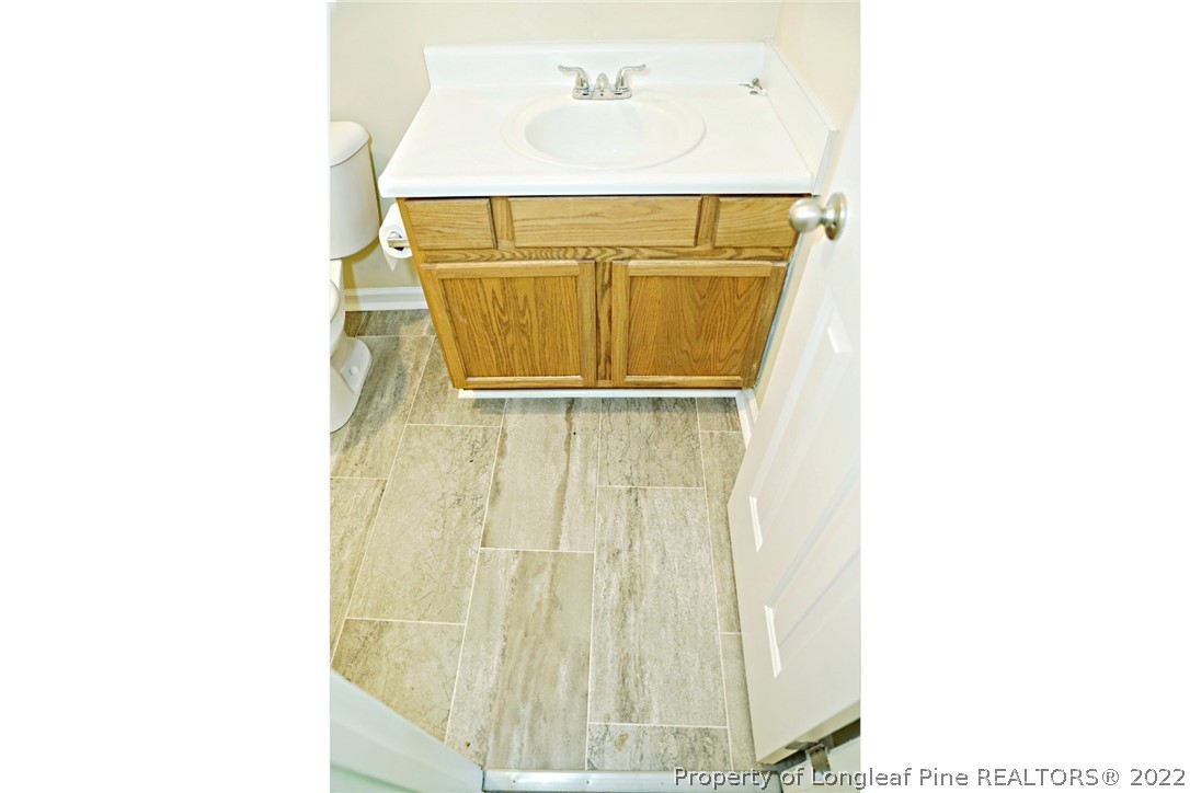 2029 Ashton Road Fayetteville, NC 28304 - Photo 21 of 37 a bathroom with a sink and a mirror