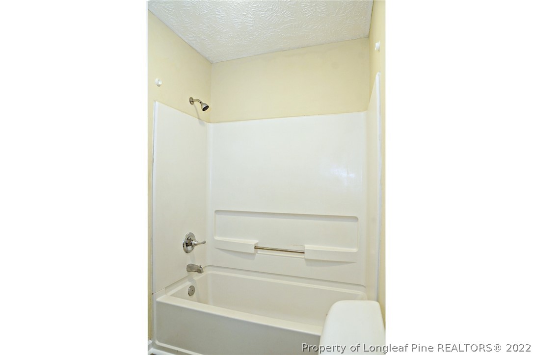 2029 Ashton Road Fayetteville, NC 28304 - Photo 22 of 37 a bathroom with a bathtub and a vanity