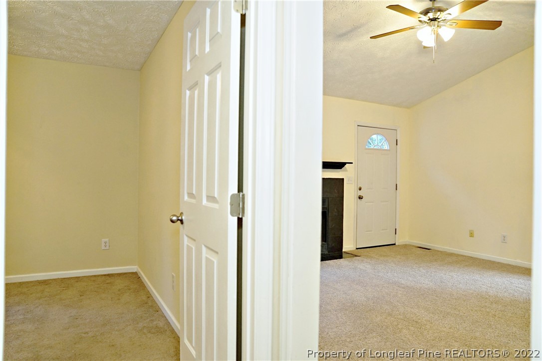 2029 Ashton Road Fayetteville, NC 28304 - Photo 30 of 37 a view of a hallway with wooden floor