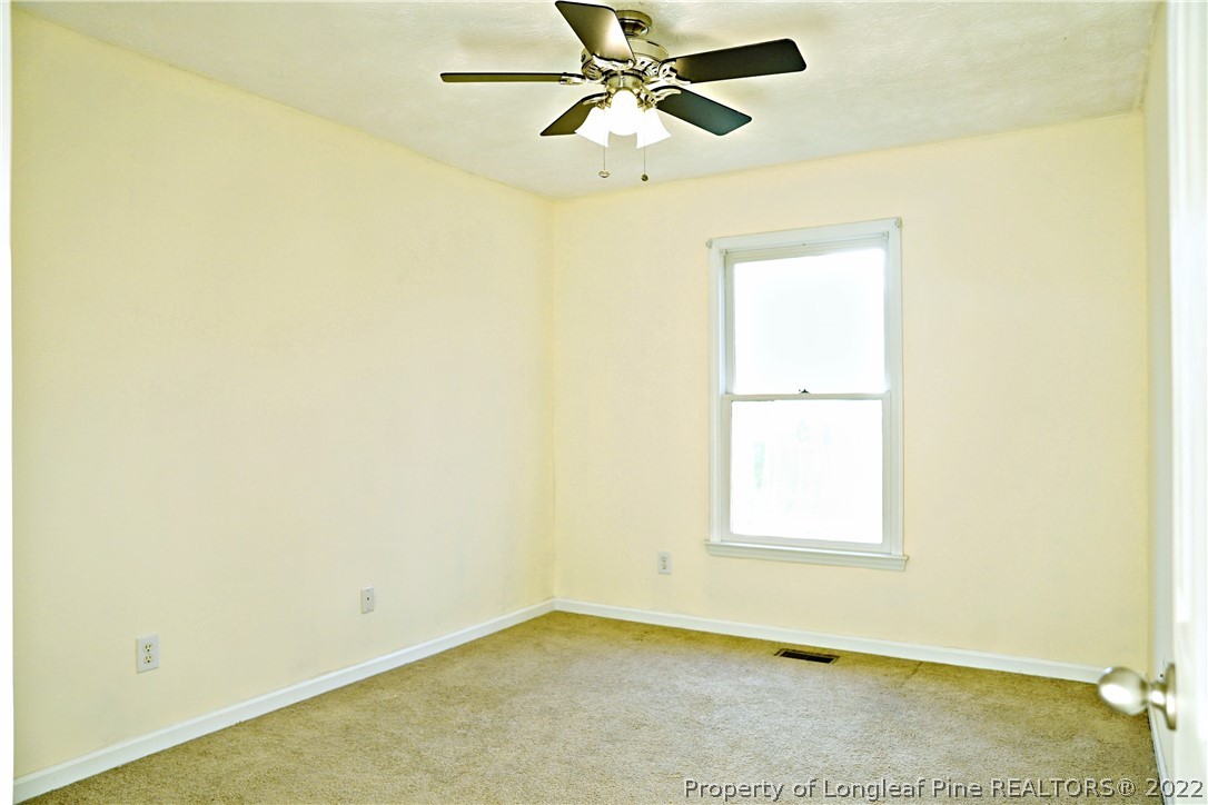 2029 Ashton Road Fayetteville, NC 28304 - Photo 31 of 37 a view of a room with a window and a ceiling fan
