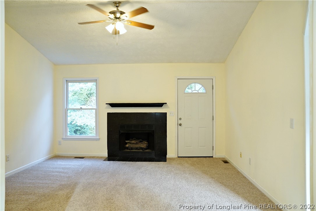 2029 Ashton Road Fayetteville, NC 28304 - Photo 10 of 37 a view of an empty room with window and fireplace