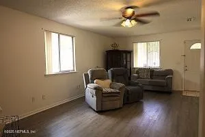 a living room with furniture and a window