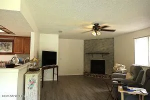 a living room with furniture and a fireplace