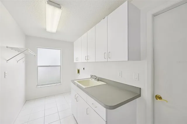 a utility room with cabinets