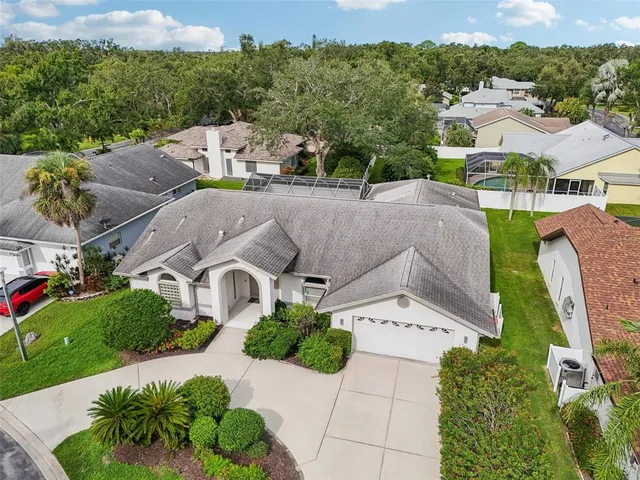 an aerial view of multiple houses with yard