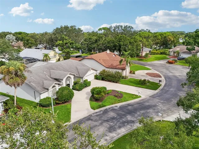 an aerial view of a house with outdoor space and street view