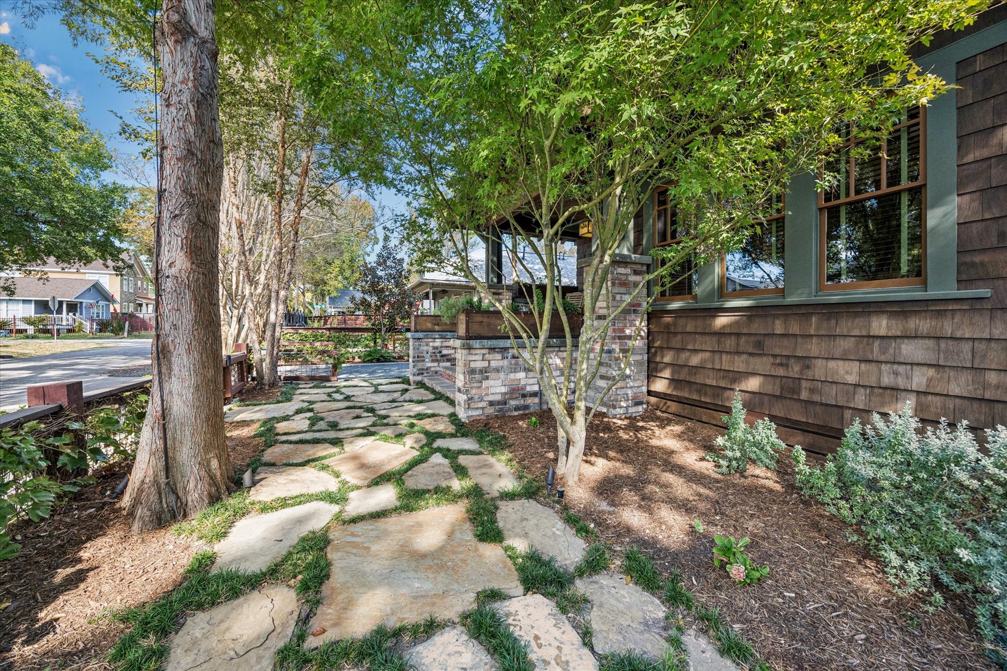 512 Archer Street Houston, TX 77009 - Photo 37 of 40 The yard is beautifully illuminated with landscape lighting, and a smart sprinkler system keeps the front, back, and side yards perfectly maintained.