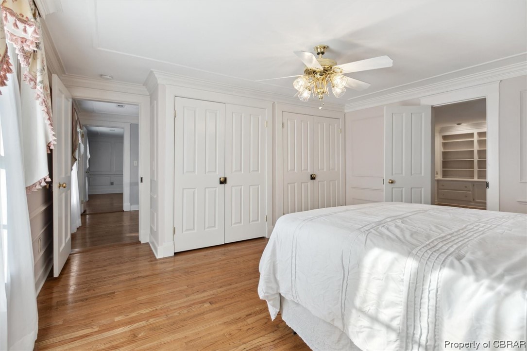 7175 Ware House Road Gloucester, VA 23061 - Photo 21 of 39 Hardwood floored bedroom with crown molding