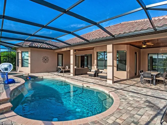a view of a swimming pool with a patio
