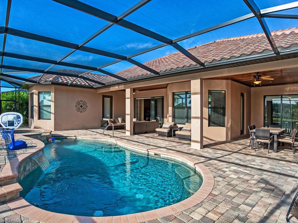a view of a swimming pool with a patio