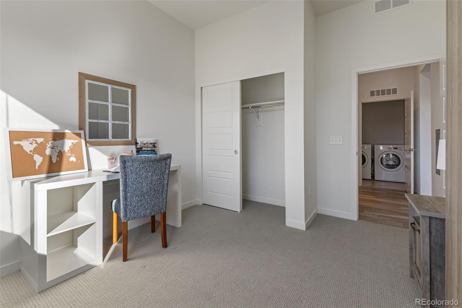 9287 Twenty Mile Road, Unit 401 Parker, CO 80134 - Photo 11 of 44 a room with furniture and window