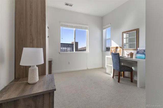 a workspace with furniture and window