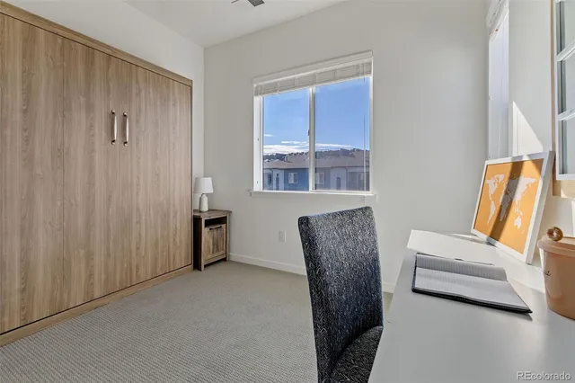 a view of room with furniture and windows