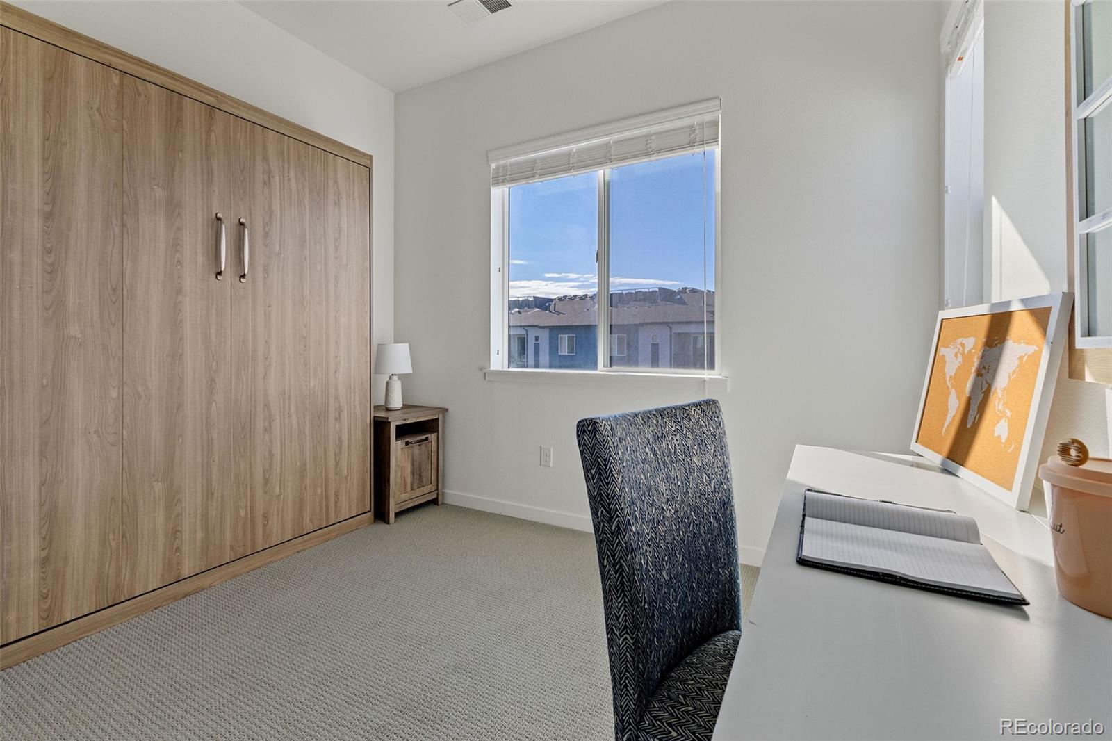 9287 Twenty Mile Road, Unit 401 Parker, CO 80134 - Photo 13 of 44 a view of room with furniture and windows